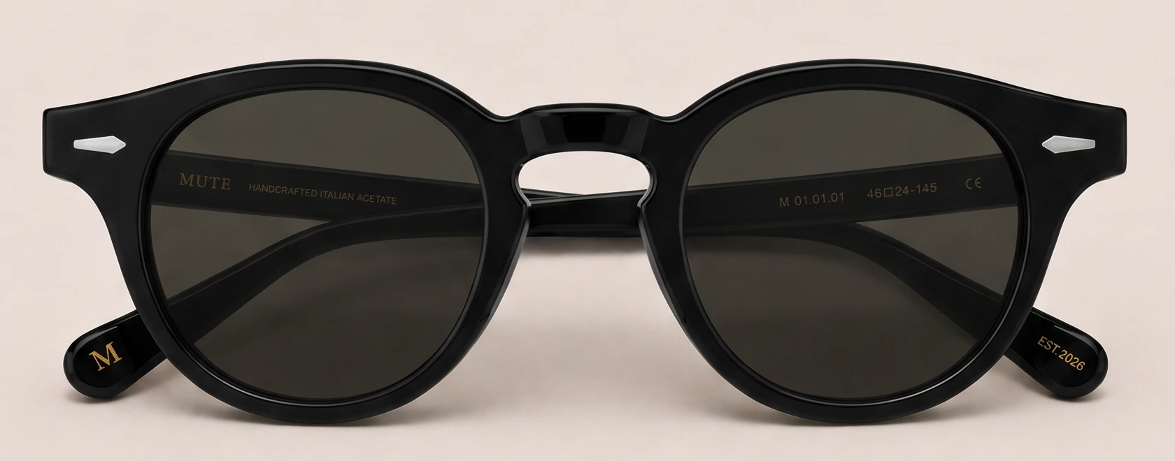MUTE 01 front view, a round black acetate frame with G15 lenses