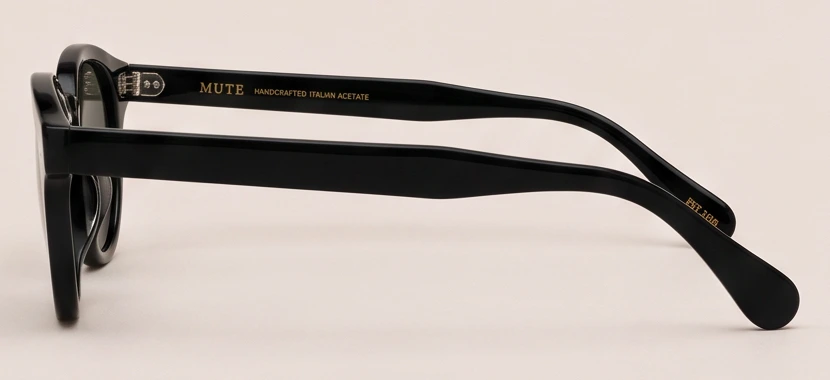 MUTE 01 in profile, showing the block-cut acetate temple and pin rivets